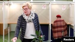Candidate Ingrida Simonyte, a former finance minister, casts her vote in the first round of Lithuania's presidential election on May 12.