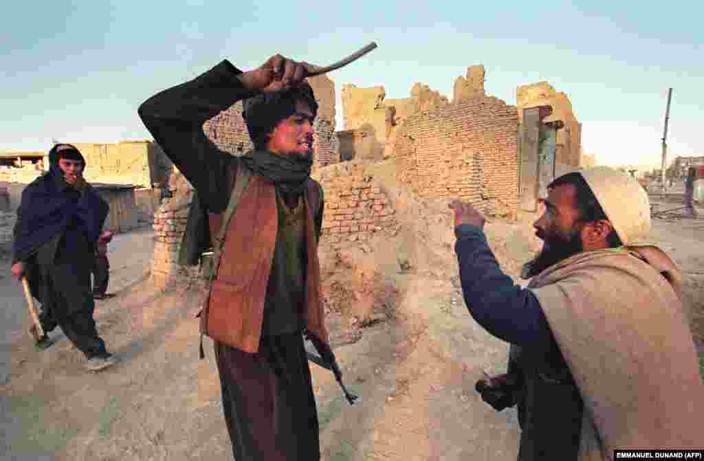 A member of the Taliban beats a man caught with half a kilogram of opium. The hard-line Sunni group vowed to restore order and eradicate corruption in war-ravaged Afghanistan.