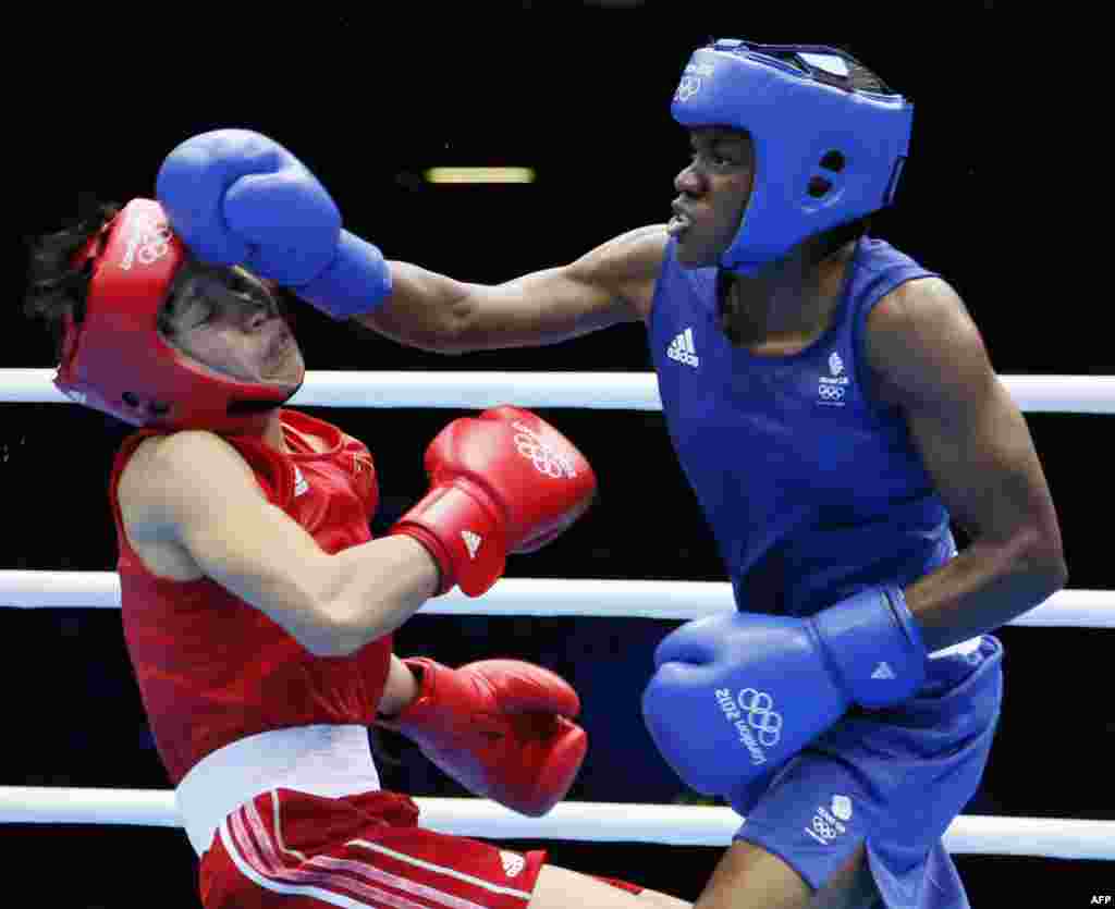 Британка Никола Адамс (справа) стала первой в истории Игр чемпионкой по женскому боксу.