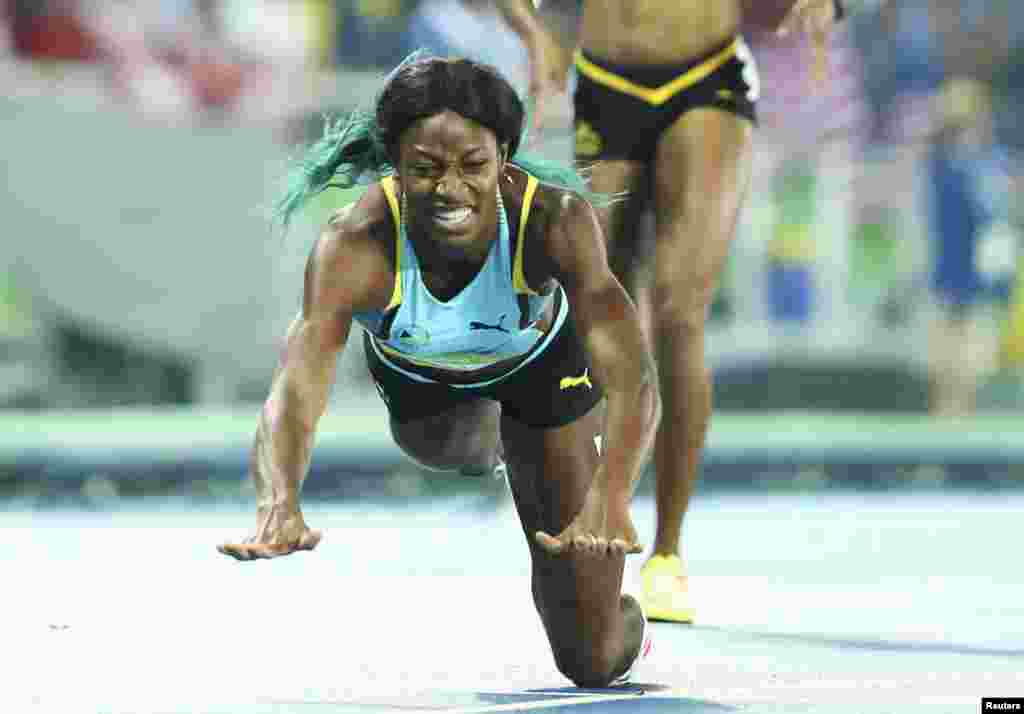 Shaunae Miller of the Bahamas dives over the finish line to win the gold in the women's 400-meter. The dive was a legal move that gave the runner an advantage of a fraction of a second.