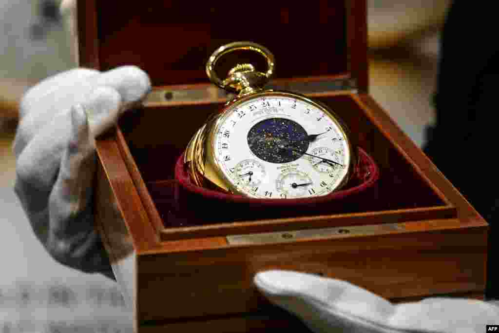 The Henry Graves Supercomplication timepiece -- the so-called Holy Grail of watches -- made by Swiss watchmaker Patek Philippe in 1932, was sold at auction in Geneva for a record $21.3 million to a mystery buyer. (AFP/Fabrice Coffrini)
