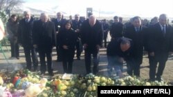Armenia - Members of the Russian State Duma lay flowers on the graves of the seven members of an Armenian family killed in Gyumri, 23Jan2015.