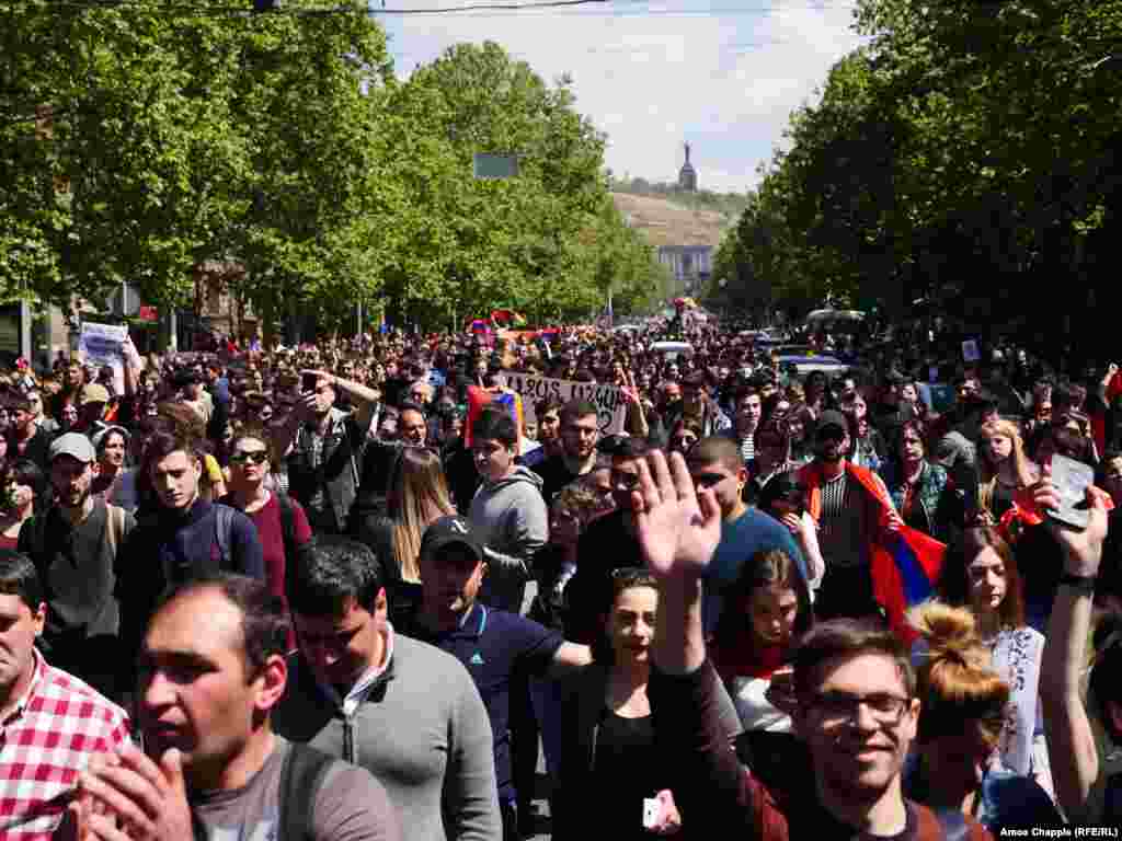 Unchallenged by police, huge crowd of mostly student demonstrators march down the central avenue of Yerevan. 