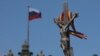 Antigay protesters attempt to remove a rainbow flag from an LGBT rally in central Moscow. (file photo)