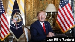 FILE: U.S. President Donald Trump speaks to the media after participating in a video teleconference with members of the U.S. military at Trump's Mar-a-Lago resort in Palm Beach, Florida on December 24 2019.