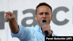 Russian opposition activist Alexei Navalny gestures while speaking to a crowd during a political protest in Moscow on July 20. 