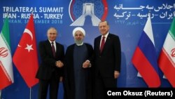 President Vladimir Putin of Russia, Hassan Rouhani of Iran and Tayyip Erdogan of Turkey meet in Tehran, Iran September 7, 2018. Cem Oksuz/Turkish Presidential Palace