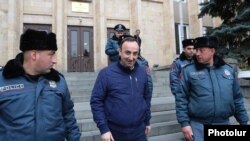 Armenia -- Constitutional Court Chairman Hrayr Tovmasian walks out of the court building in Yerevan, December 27, 2019.