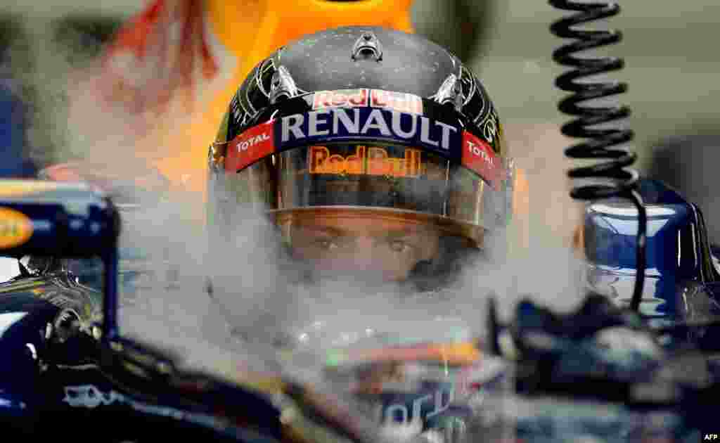 German Formula One racing driver Sebastian Vettel during practice ahead of the Singapore Grand Prix in September.Vettel went on to clinch his third consecutive world championship later in the year. (AFP/Punit Paranjpe)