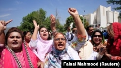 Supporters of former Pakistan Prime Minister Nawaz Sharif chant slogans following the Supreme Court decision to disqualify him from holding office for life.