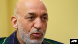 Afghan President Hamid Karzai was presented with a collection of documents while visiting the United States.