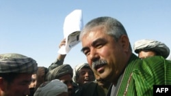 General Abdul Rashid Dostum greets supporters in the Sheberghan region during the 2004 Afghan presidential election.