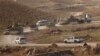 Vehicles belonging to Kurdish Peshmerga forces are seen in the town of Sinjar on November 12.