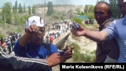 Protesters in Barskook, near the Kumtor mining operations, show shotgun shells after the main clashes on May 31.