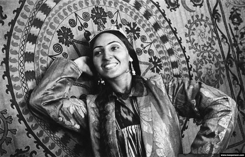 A woman poses with a panel of traditional Uzbek embroidery. Penson was soon employed by the Soviet newspaper Pravda Vostoka [Truth Of The East] to shoot Soviet propaganda images as well as daily life.