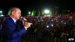 Turkish President Recep Tayyip Erdogan addresses those gathered at the Presidential Complex to protest the July 15 failed military coup attempt in Ankara, August 10.