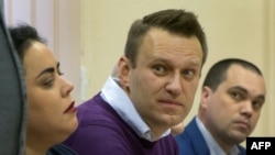 Aleksei Navalny (center) looks on during a court hearing in Kirov on December 5.