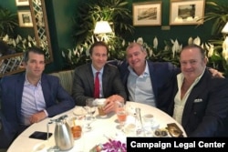 A Facebook screen shot provided by the Campaign Legal Center shows from left to right: Donald Trump Jr, Tommy Hicks Jr, Lev Parnas, and Igor Fruman in May 2018.