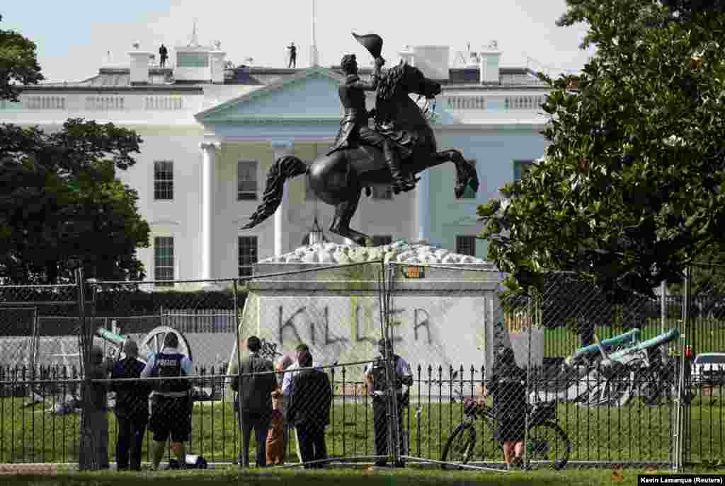 he word "Killer" is seen on the statue of U.S. President Andrew Jackson across from the White House a day after racial inequality protesters attempted to tear down the statue in Washington, D.C., U.S., June 23, 2020. 