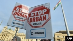 Placards opposing Hungarian Prime Minister Viktor Orban are raised ahead of the April 8 vote.