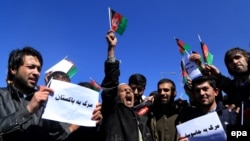 Afghans shout slogans protesting Pakistan's last week cross-border rocket shelling, in Kabul, on February 23.