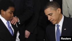 U.S. President Barack Obama signs the health insurance reform bill into law in Washington, D.C., on March 23, 2010.