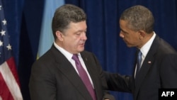 Poland -- US President Barack Obama and President-elect Petro Poroshenko of Ukraine talk during a meeting in Warsaw, June 4, 2014