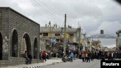 Protesters gather near the Al-Omari Mosque in the southern city of Daraa on March 22.