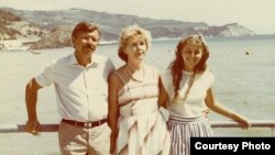 Natalia Churikova (right) poses with her stepfather, Oleksander Pavlenko, and her mother, Valentyna Pavlenko, on holiday in Crimea in 1987 -- one year after the disaster at Chornobyl.