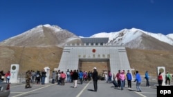 FILE: People gather at the 4730 meter (15,520 ft) high Khunjerab Pass, a high mountain pass, which also seres as border crossing between Chin and Pakistan.