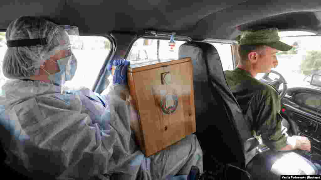 A ballot box is transported on the main day of voting.