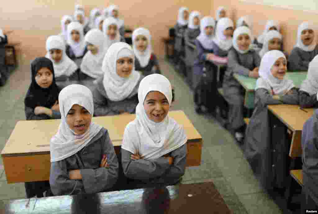 Girls attend classes at an Islamic school. Sadr City bears the name of revered Shi&#39;ite cleric Muhammad al-Sadr, who was killed in 1999, reportedly by agents of the Iraqi regime.