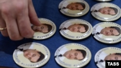 Pins bearing portraits of Sergei Magnitsky and produced by the Moscow Sakharov Center in 2013 to mark the late lawyer's 41st birthday