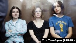 The three convicted members of Pussy Riot in a Moscow courtroom on August 17