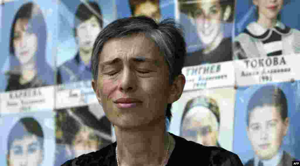 A woman cries in front of a memorial to students killed at School No.1 in Beslan, North Ossetia.