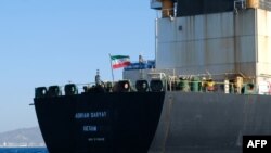 An Iranian flag flutters on board the Adrian Darya-1 oil tanker, formerly known as Grace 1, off the coast of Gibraltar on August 18, 2019.