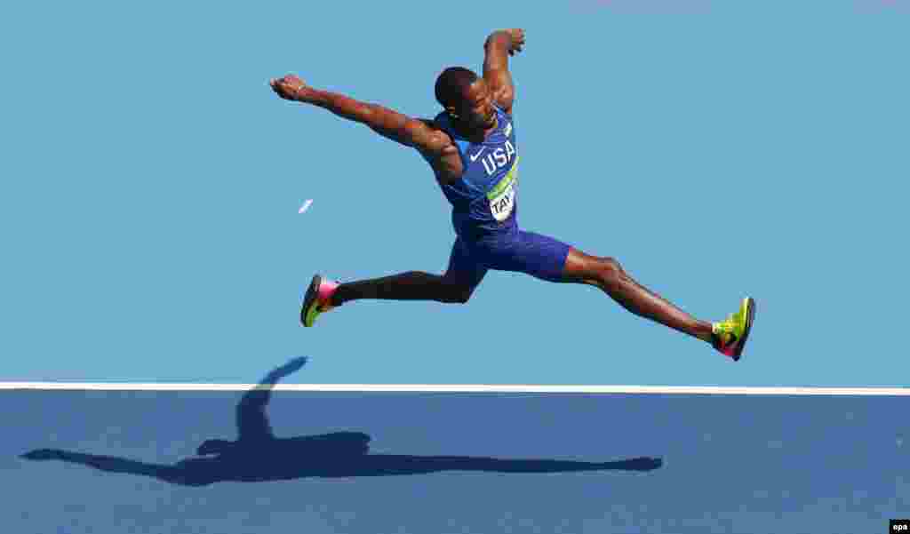 Christian Taylor of the United States defends his title in the men's triple-jump final.