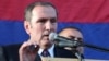 Opposition leader Levon Ter-Petrossian addresses thousands of supporters who rallied in Yerevan on May 31. "It doesn’t mean that we should not take into account...the agenda and counterarguments presented by the authorities," he said.