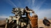 Iraqi Army personnel reload ammunition during clashes with Islamic State militants north of Mosul on December 29. 