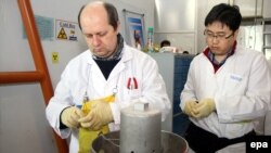 IAEA inspectors check the enrichment process inside the uranium enrichment plant Natanz, January 20, 2014