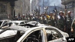 Syria -- Government soldiers celebrate in the al-Midan area in Damascus, 20Jul2012