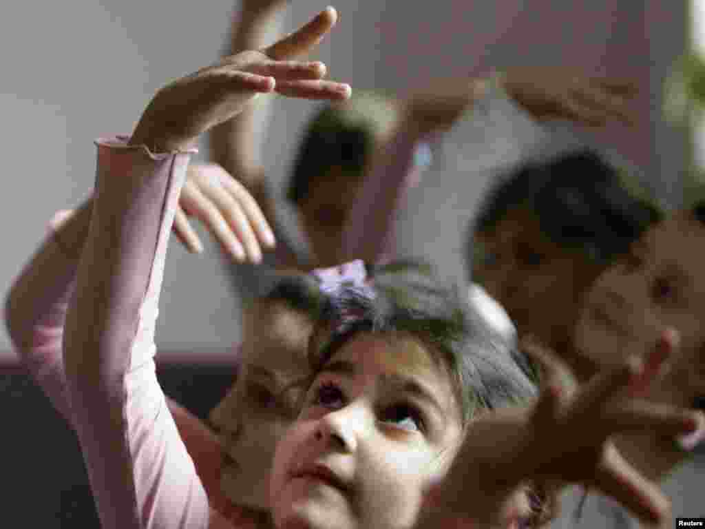 Girls practice during class at a ballet school for children in Tbilisi. - Photo by David Mdzinarishvili for Reuters