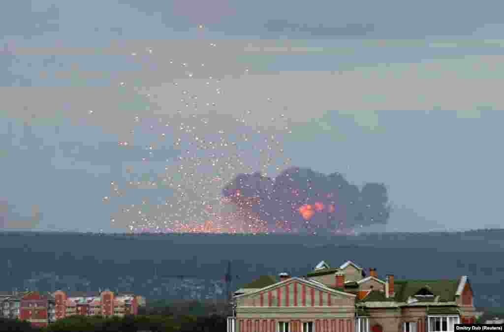 RUSSIA -- A view shows flame and smoke rising from the site of blasts at an ammunition depot near the town of Achinsk in Krasnoyarsk region, August 5, 2019