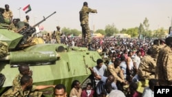 Thousands have kept up their sit-in outside the military headquarters in Khartoum.