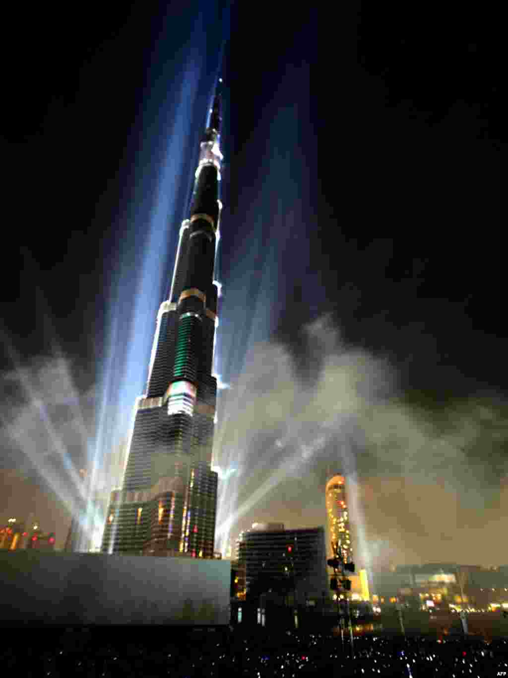 Dubai's Burj Khalifa tower, the world's tallest skyscraper, is illuminated by lasers during its opening ceremony on January 4. Photo by Karim Sahib for AFP