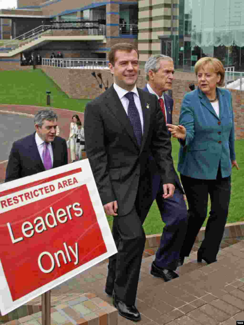 World leaders - Group of Eight meeting in Japan -- (left to right) British Prime Minister Gordon Brown, Russian President Dmitry Medvedev, U.S. President George W. Bush, and German Chancellor Angela Merkel at summit in Tokyo, July 9, 2008