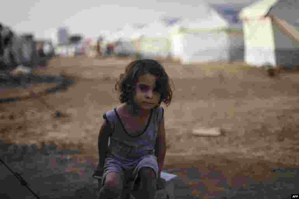 A young boy who fled fighting around Mosul with his family in the Hasan Shami camp for internally displaced people, Iraq, on November 14. (AFP/Achilleas Zavallis)