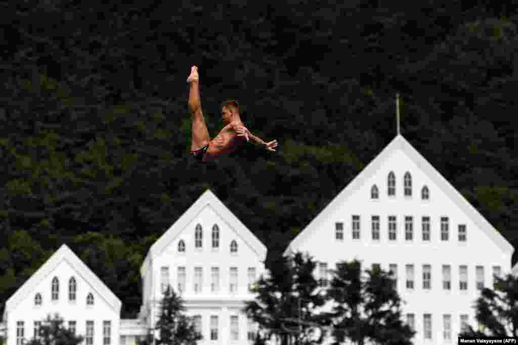 Russia&#39;s Nikita Fedotov competes in a round of the men&#39;s high-diving event during the 2019 World Championships at Chosun University in Gwangju, South Korea. (AFP/Manan Vatsyayana)
