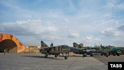 A MiG-23 fighter aircraft of the Syrian Air Force prepares for a flight at Hama air base, November 7, 2015