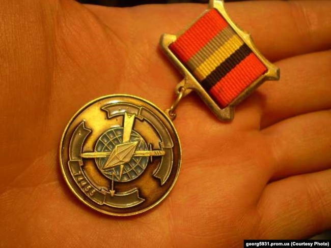 Russian medal with emblem of GRU military unit No. 74455